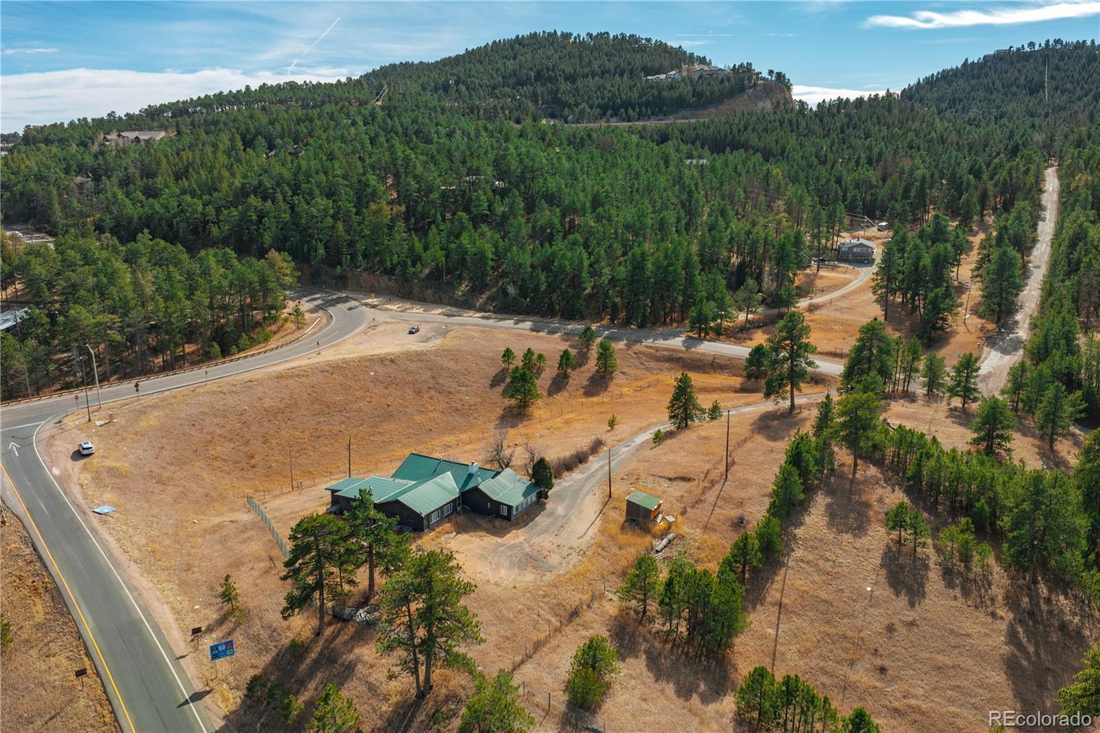 29793 Ruby Ranch Road Evergreen, CO 80439 - Photo 16 of 39 a view of a lake with a yard