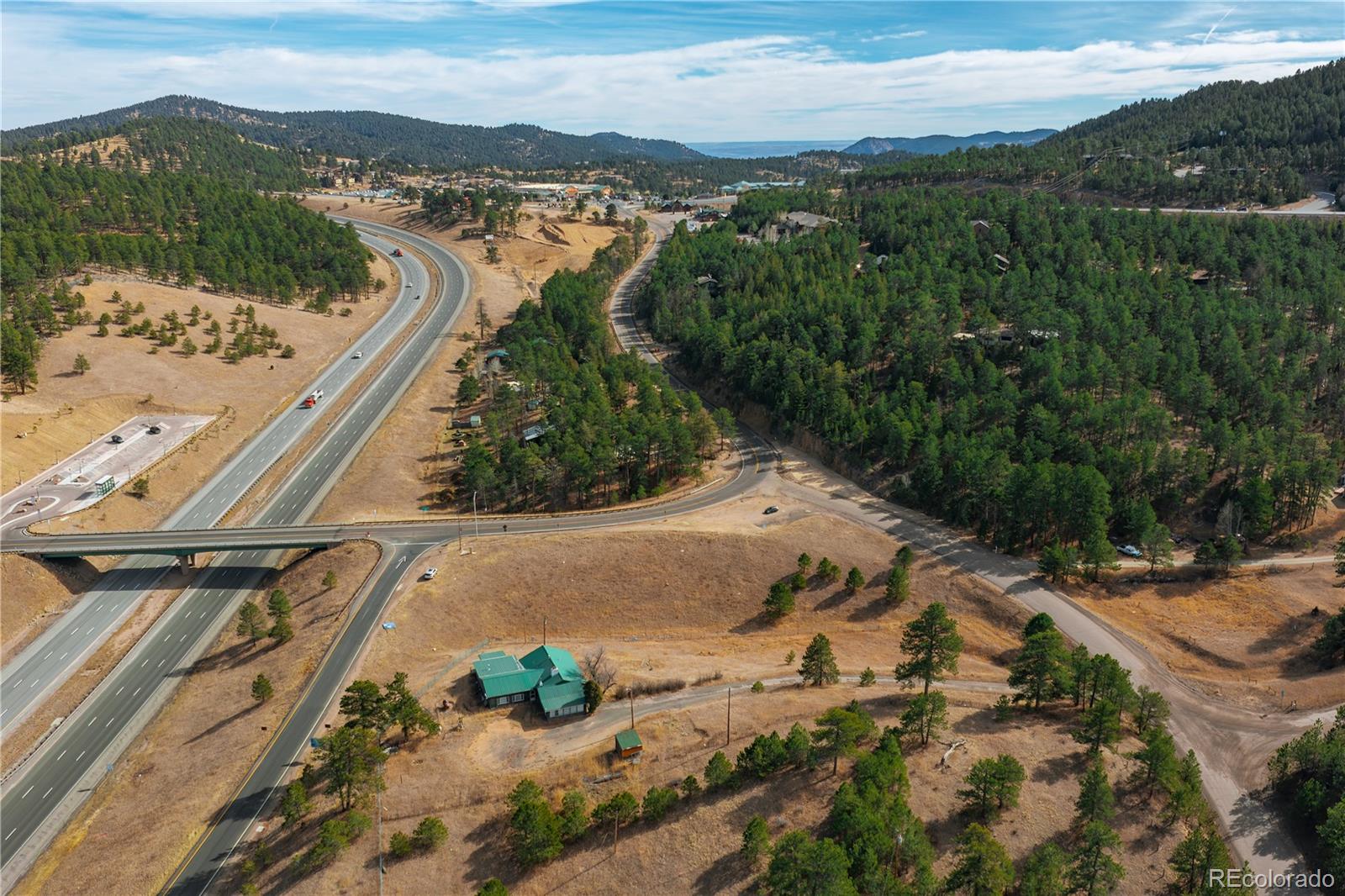 29793 Ruby Ranch Road Evergreen, CO 80439 - Photo 18 of 39 an aerial view of residential houses with outdoor space