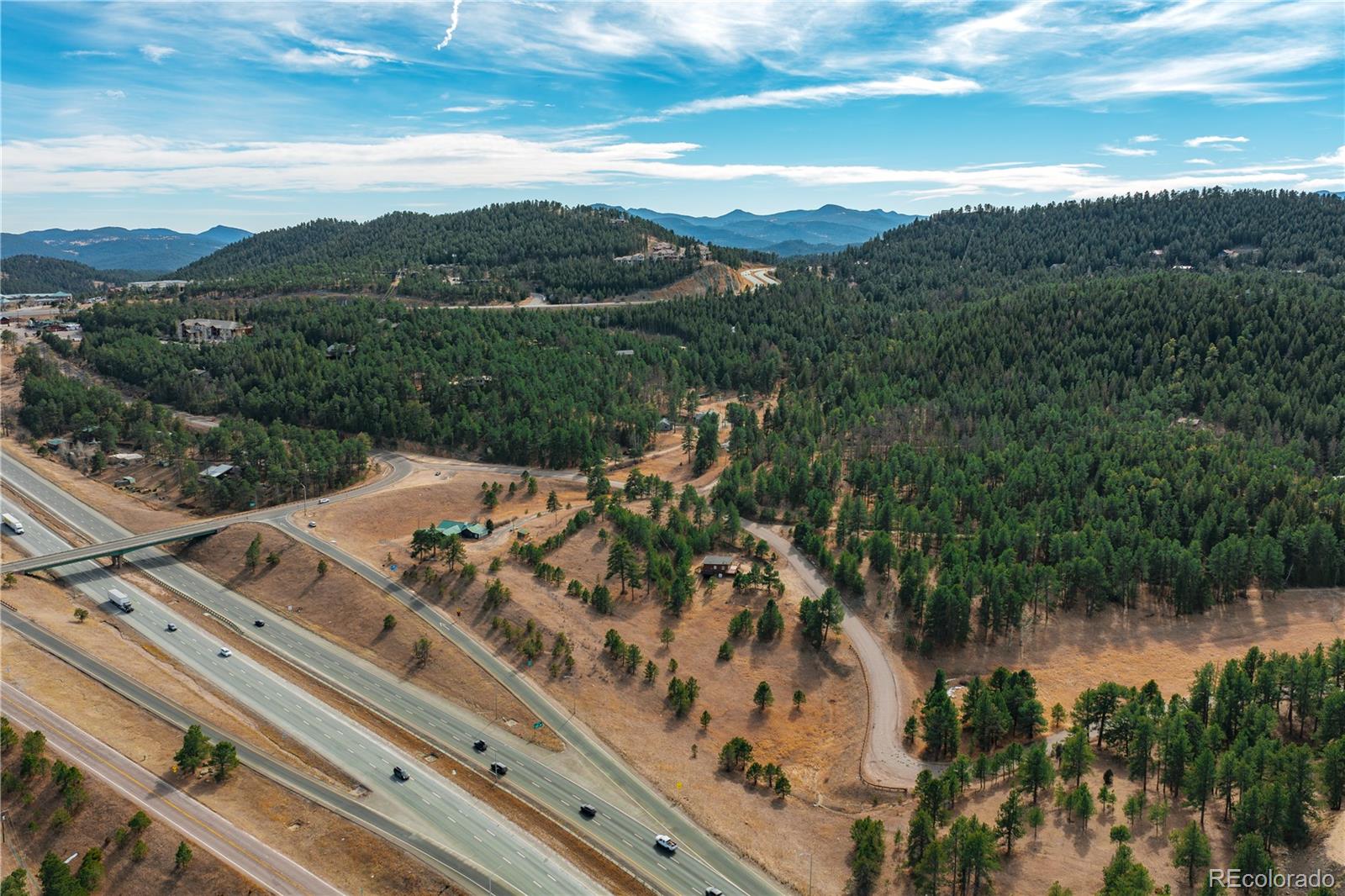 29793 Ruby Ranch Road Evergreen, CO 80439 - Photo 24 of 39 a view of a lake with a mountain