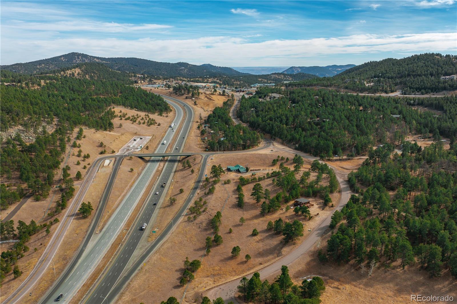 29793 Ruby Ranch Road Evergreen, CO 80439 - Photo 25 of 39 a view of a city with mountains in the background