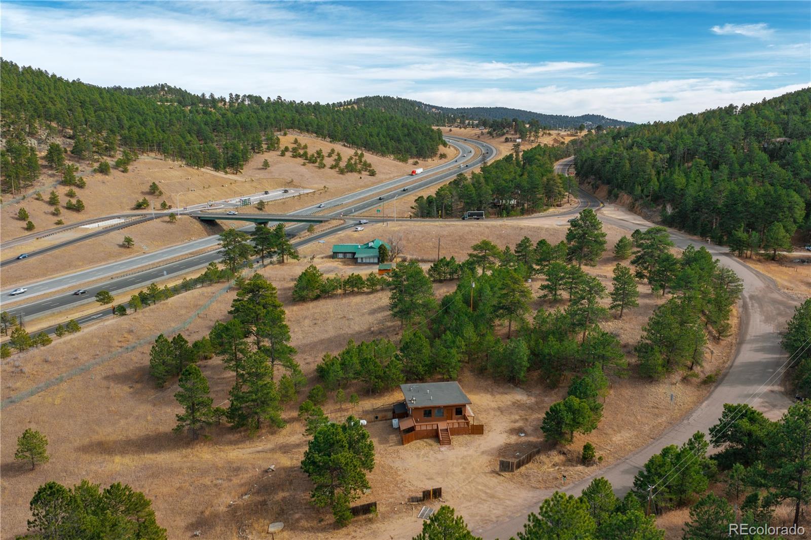 29793 Ruby Ranch Road Evergreen, CO 80439 - Photo 26 of 39 an aerial view of a house with mountain view
