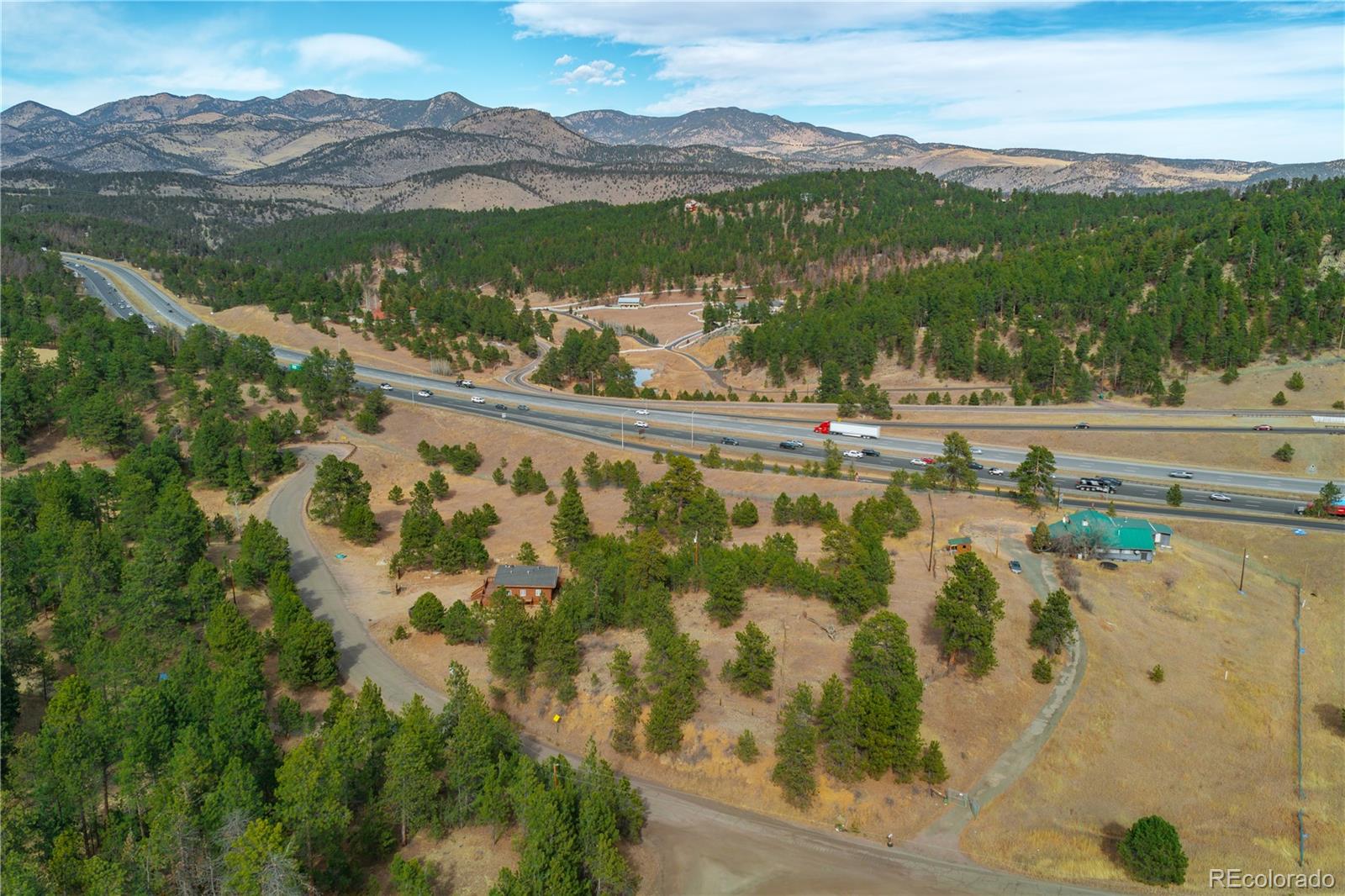29793 Ruby Ranch Road Evergreen, CO 80439 - Photo 29 of 39 a view of lake with mountain