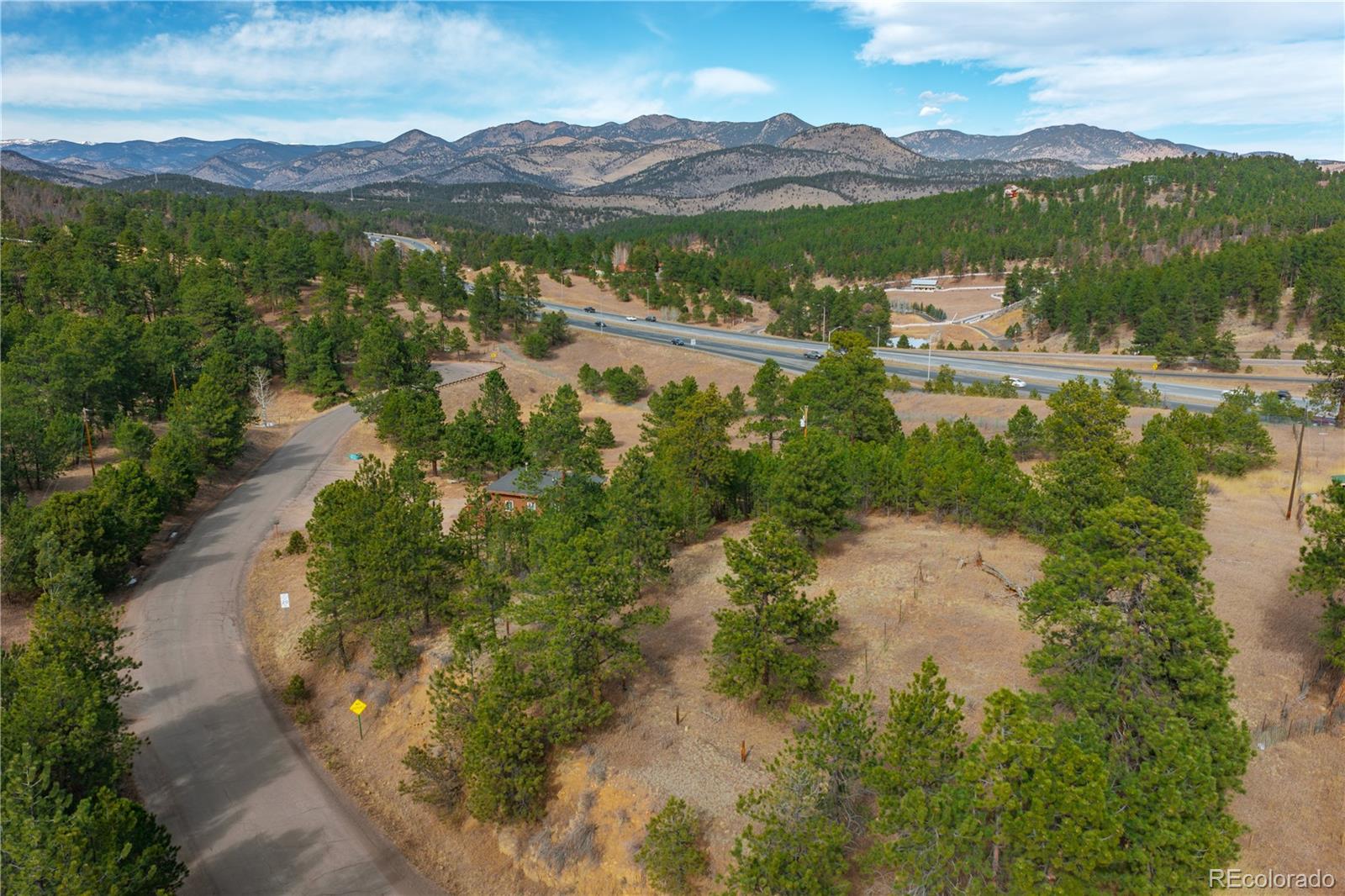 29793 Ruby Ranch Road Evergreen, CO 80439 - Photo 32 of 39 a view of lake with mountain