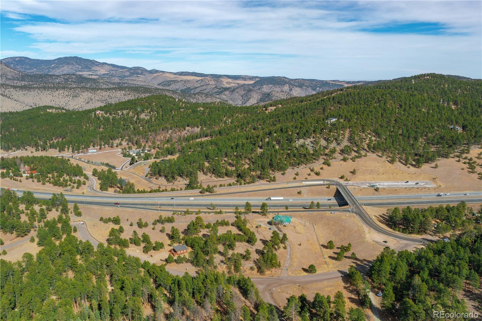 29793 Ruby Ranch Road Evergreen, CO 80439 - Photo 5 of 39 a view of a city with mountains in the background