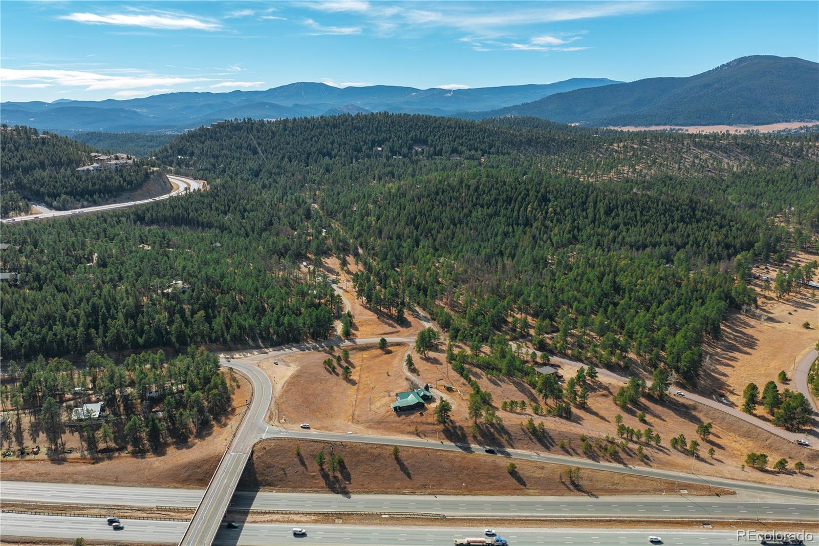29793 Ruby Ranch Road Evergreen, CO 80439 - Photo 8 of 39 a view of a city with mountain