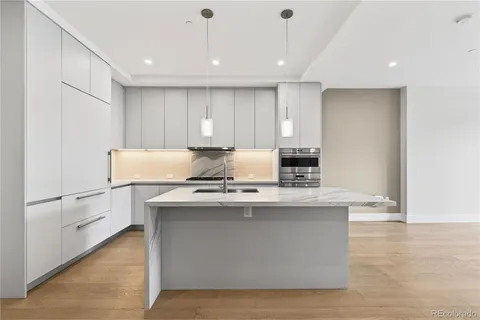 a view of kitchen with wooden floor