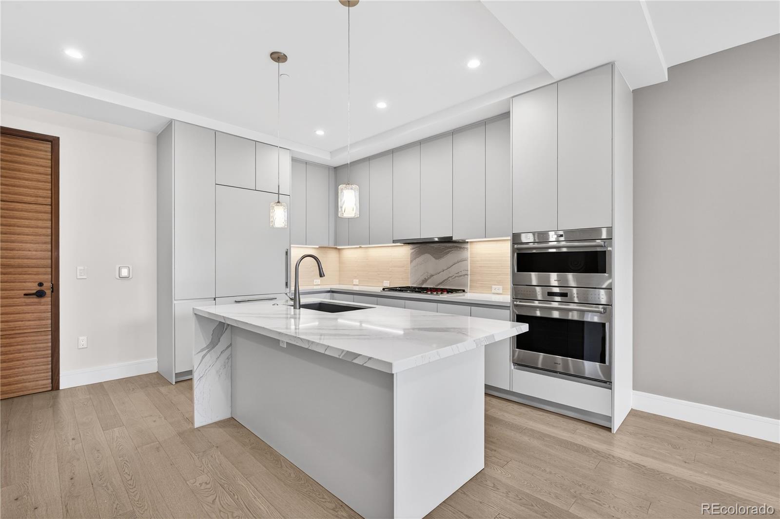 1901 Wazee Street, Unit 515 Denver, CO 80202 - Photo 12 of 46 a kitchen with a stove and a refrigerator