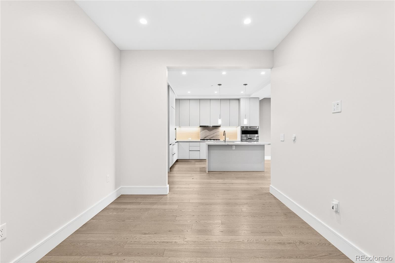 1901 Wazee Street, Unit 515 Denver, CO 80202 - Photo 15 of 46 a view of kitchen with wooden floor