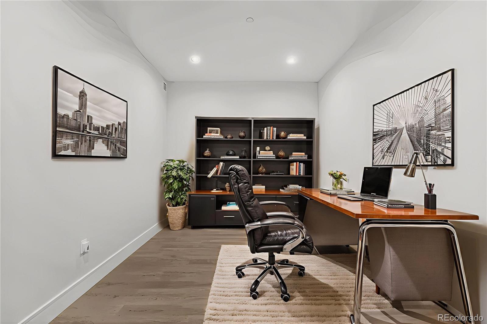 1901 Wazee Street, Unit 515 Denver, CO 80202 - Photo 18 of 46 a view of a workspace with furniture and wooden floor