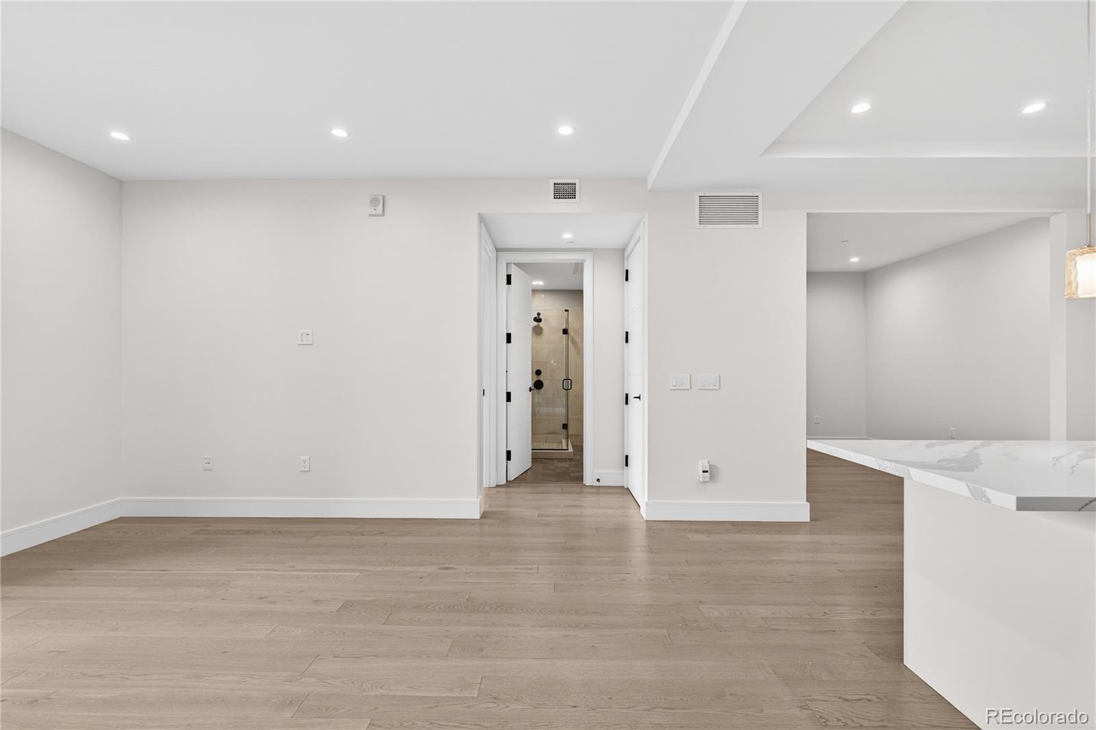1901 Wazee Street, Unit 515 Denver, CO 80202 - Photo 21 of 46 an empty room with cabinet and mirrors