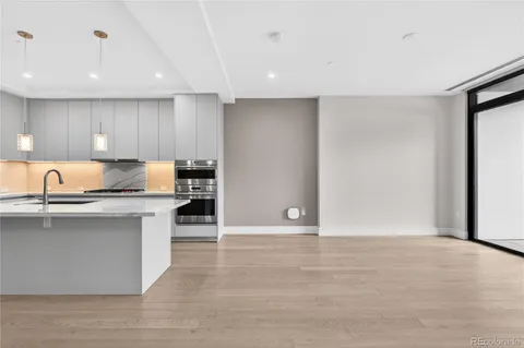 a view of kitchen with wooden floor