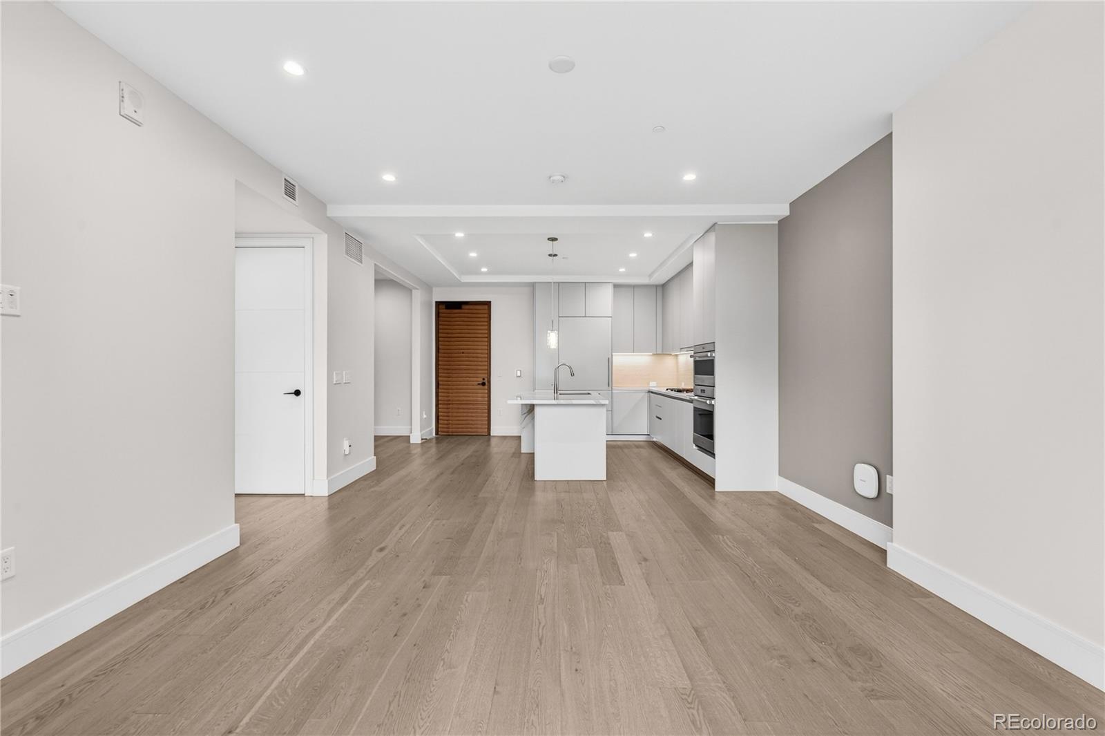 1901 Wazee Street, Unit 515 Denver, CO 80202 - Photo 24 of 46 a view of a kitchen with wooden floor