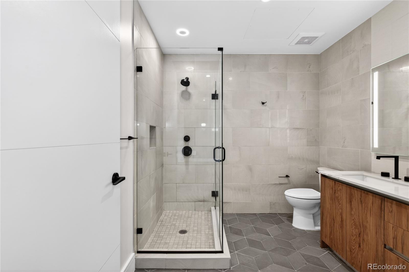 1901 Wazee Street, Unit 515 Denver, CO 80202 - Photo 27 of 46 a bathroom with a shower toilet and sink