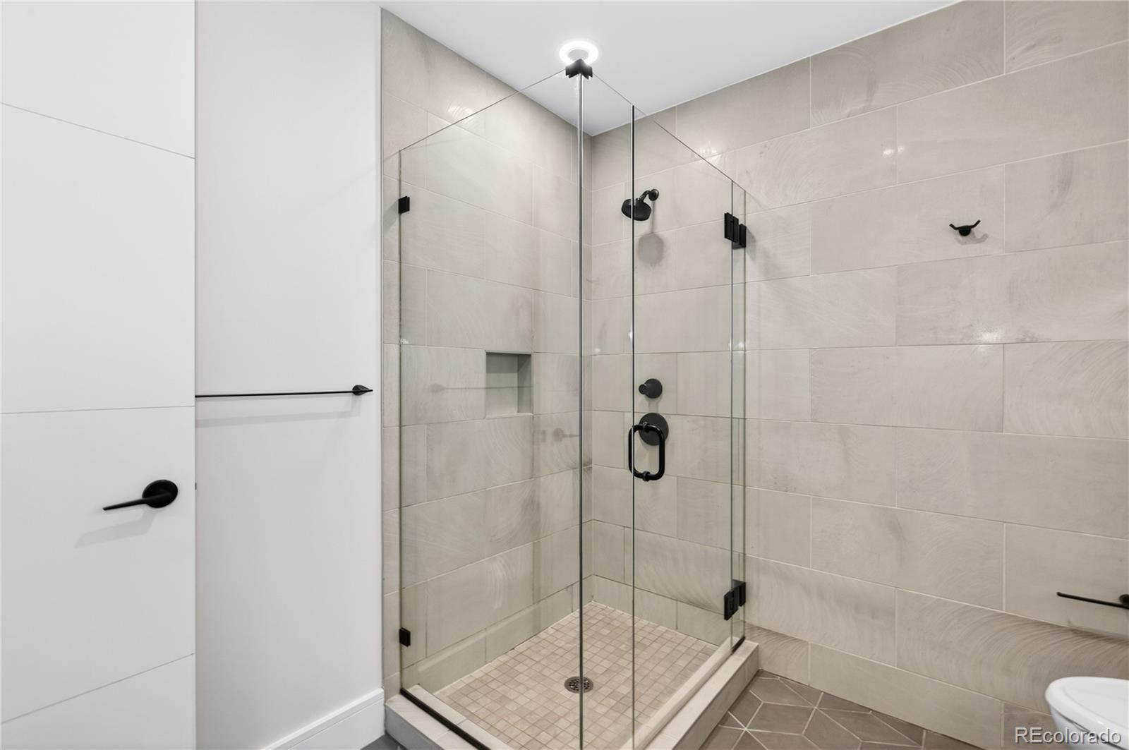 1901 Wazee Street, Unit 515 Denver, CO 80202 - Photo 29 of 46 a bathroom with a shower and toilet