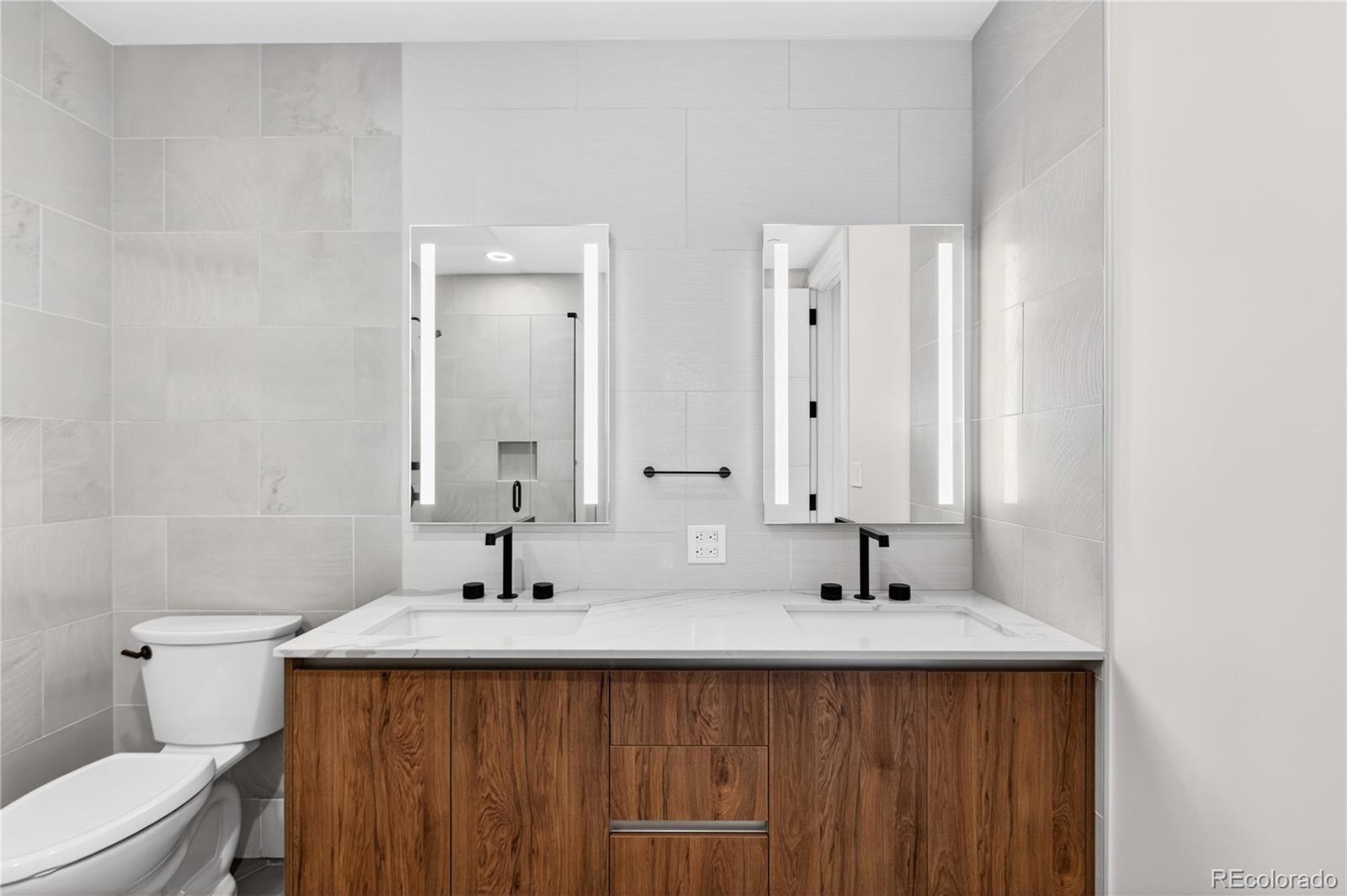 1901 Wazee Street, Unit 515 Denver, CO 80202 - Photo 30 of 46 a bathroom with a sink and a mirror