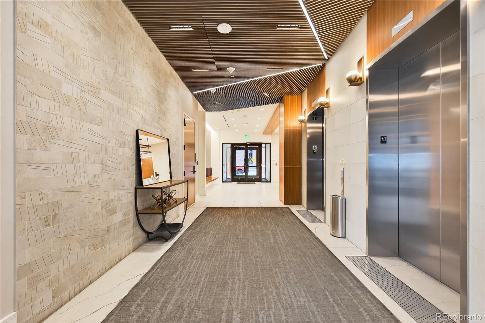 1901 Wazee Street, Unit 515 Denver, CO 80202 - Photo 39 of 46 a view of a hallway with wooden floor and staircase