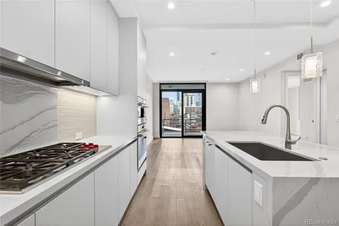 a kitchen with a stove and a refrigerator