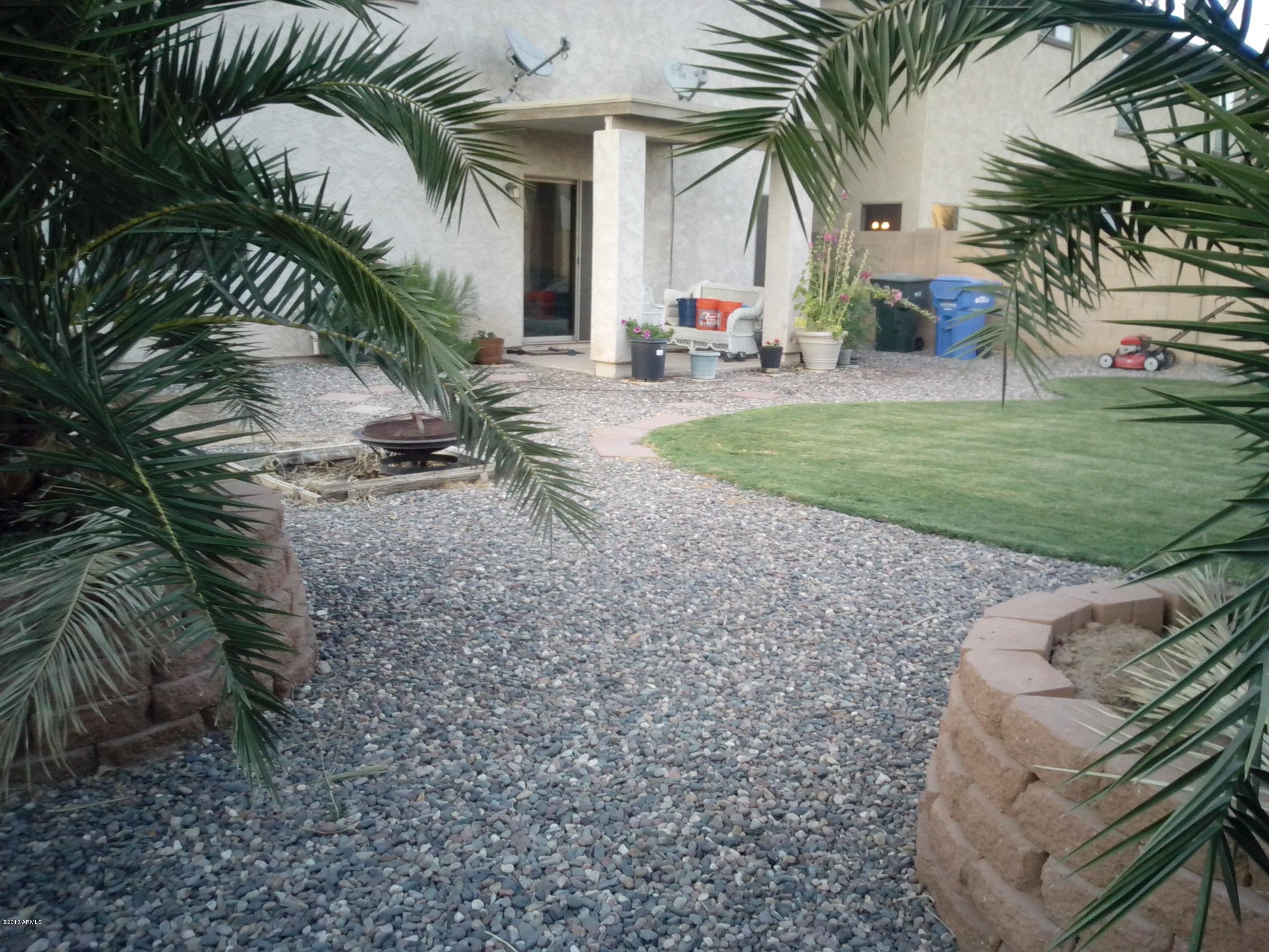 9427 West Monte Vista Road Phoenix, AZ 85037 - Photo 12 of 13 a view of a yard with a patio