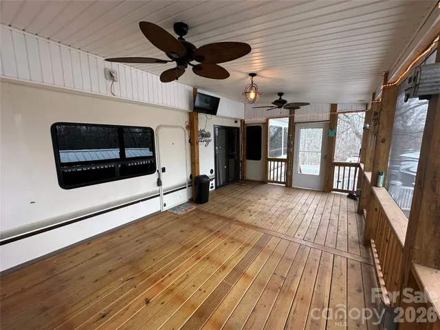a view of a livingroom with wooden floor