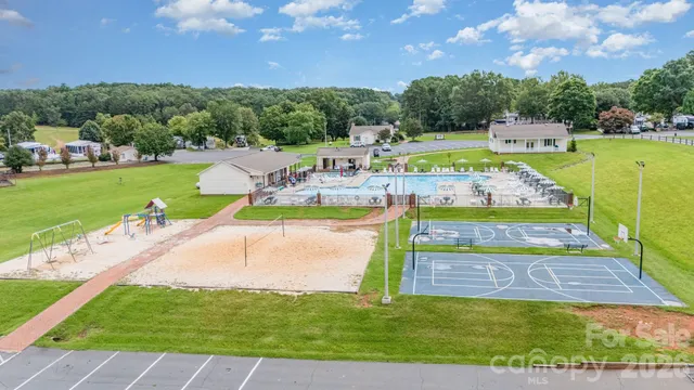 a view of a swimming pool with a yard