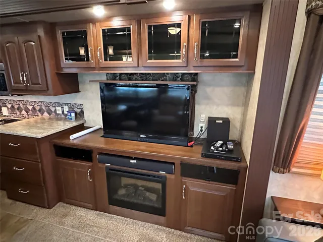 a kitchen with a stove and a microwave