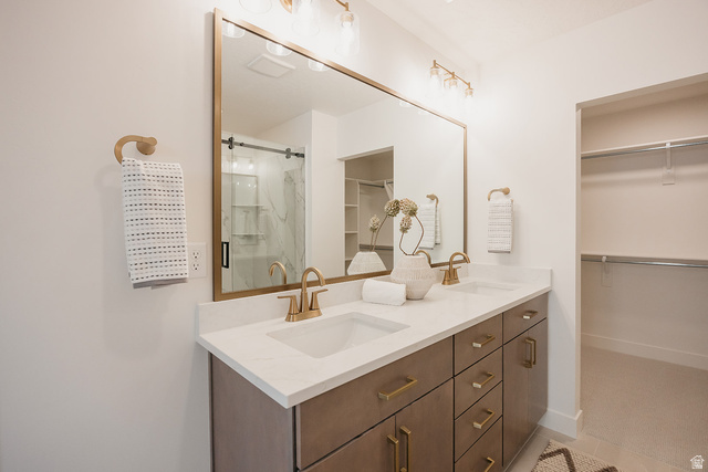5902 Canyon Rim Road, Unit 620 Lehi, UT 84048 - Photo 46 of 78 Dual vanity with stone-finish countertop, undermount sinks, and gold-tone fixtures