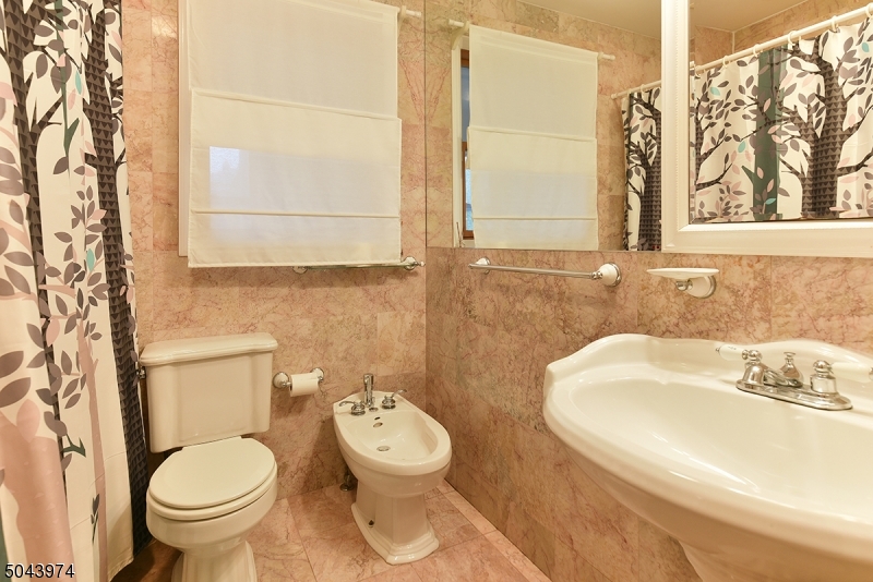 72 Rector Street Millburn, NJ 07041 - Photo 13 of 14 a bathroom with a sink and a toilet