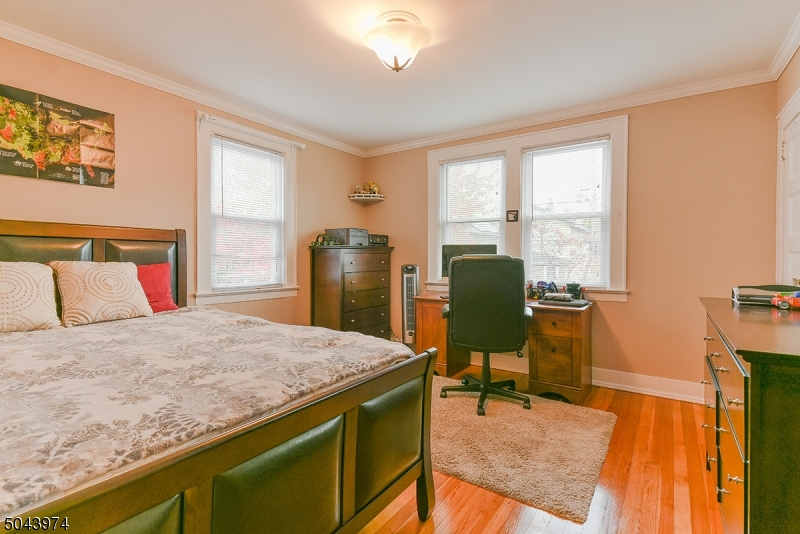 72 Rector Street Millburn, NJ 07041 - Photo 9 of 14 a bedroom with a bed and furniture