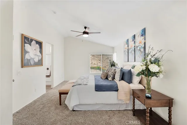 a living room with furniture flowerpot and a chandelier