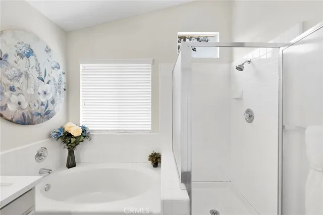a white bath tub sitting next to a white sink