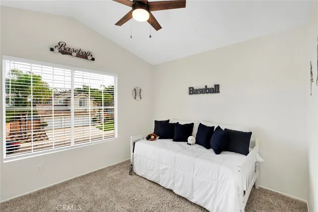 a bedroom with bed and window