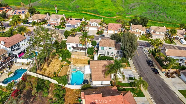 an aerial view of multiple houses with yard