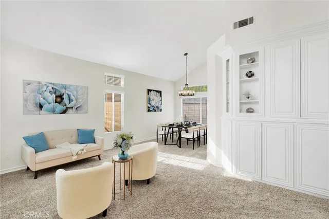 a living room with furniture and a table