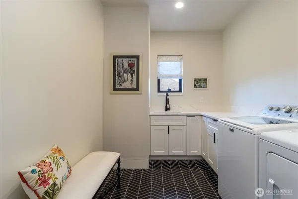 a bathroom with a sink toilet and window