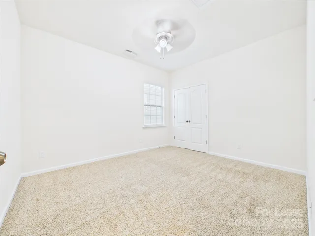 a white toilet sitting next to a white sink