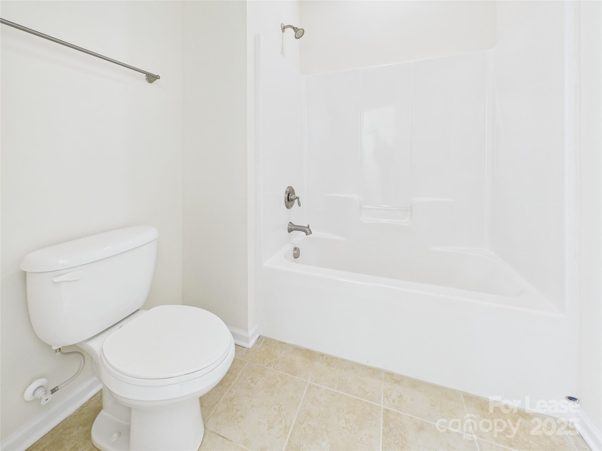 1249 Reflection Avenue Northwest Concord, NC 28027 - Photo 16 of 25 a white toilet sitting next to a white sink