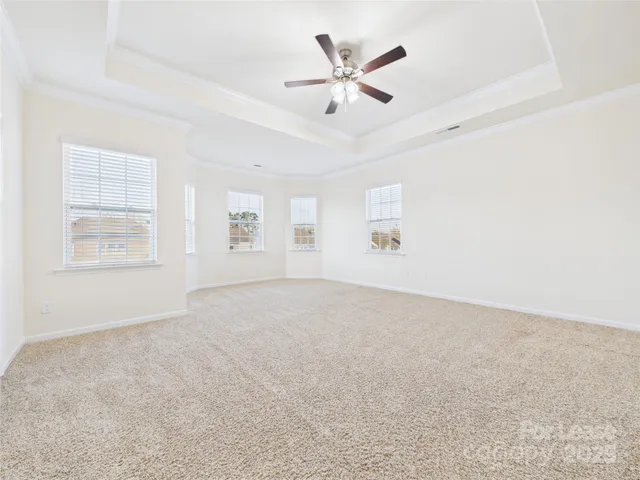 a view of an empty room with a fan