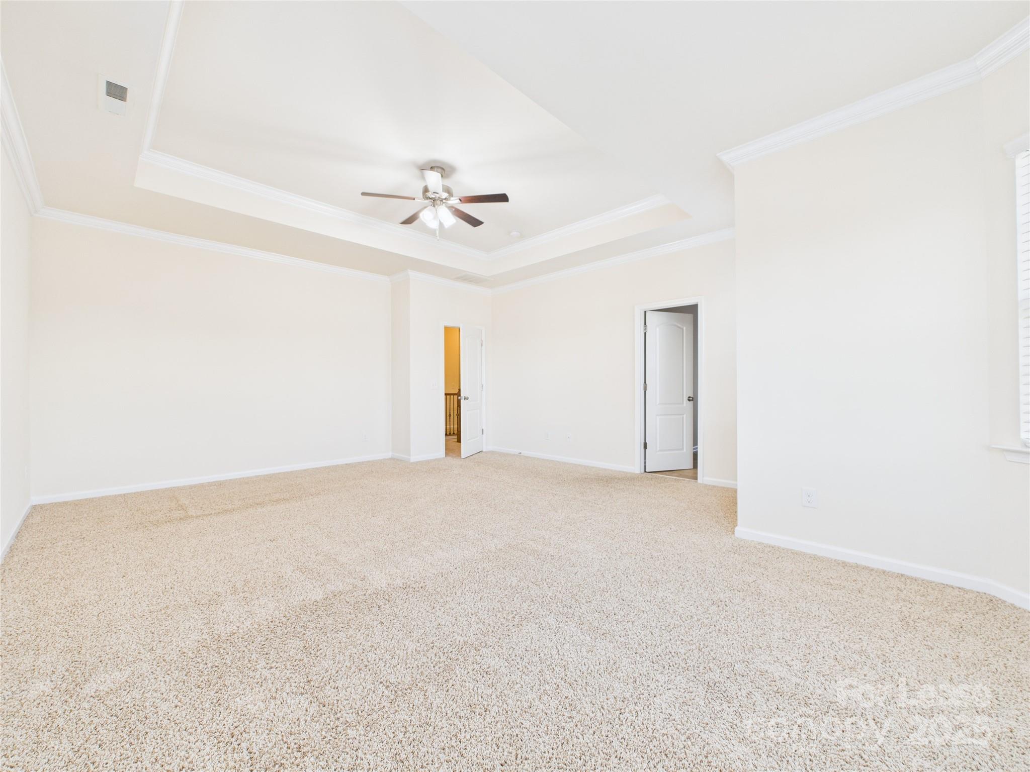 1249 Reflection Avenue Northwest Concord, NC 28027 - Photo 21 of 25 a view of an empty room with a fan