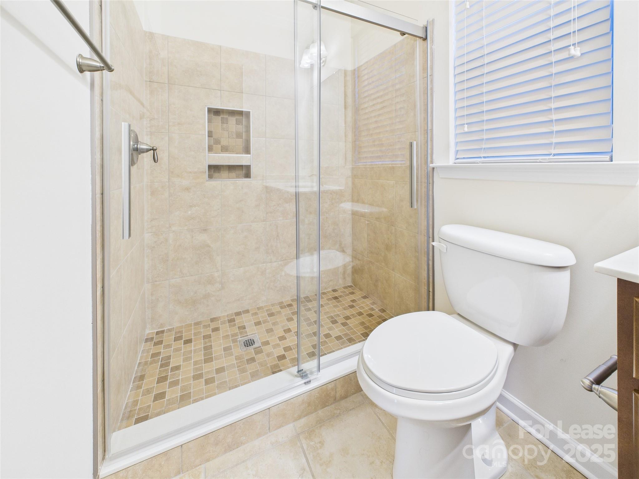 1249 Reflection Avenue Northwest Concord, NC 28027 - Photo 23 of 25 a bathroom with a toilet and shower