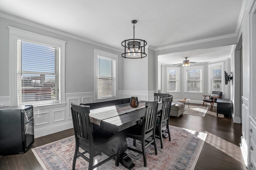 a view of a dining room with furniture window and wooden floor