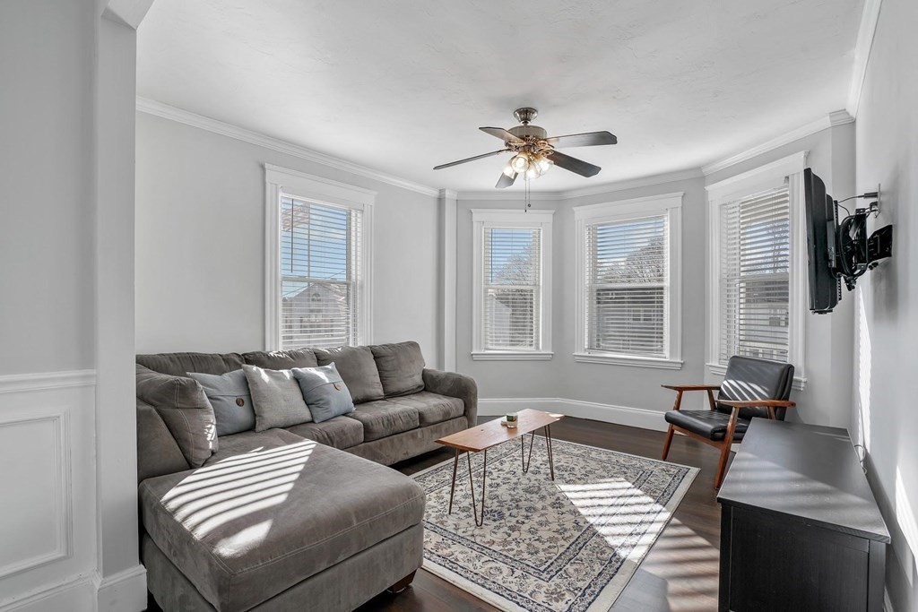 12 Clover Street, Unit 2 Boston, MA 02122 - Photo 3 of 13 a living room with furniture and a window