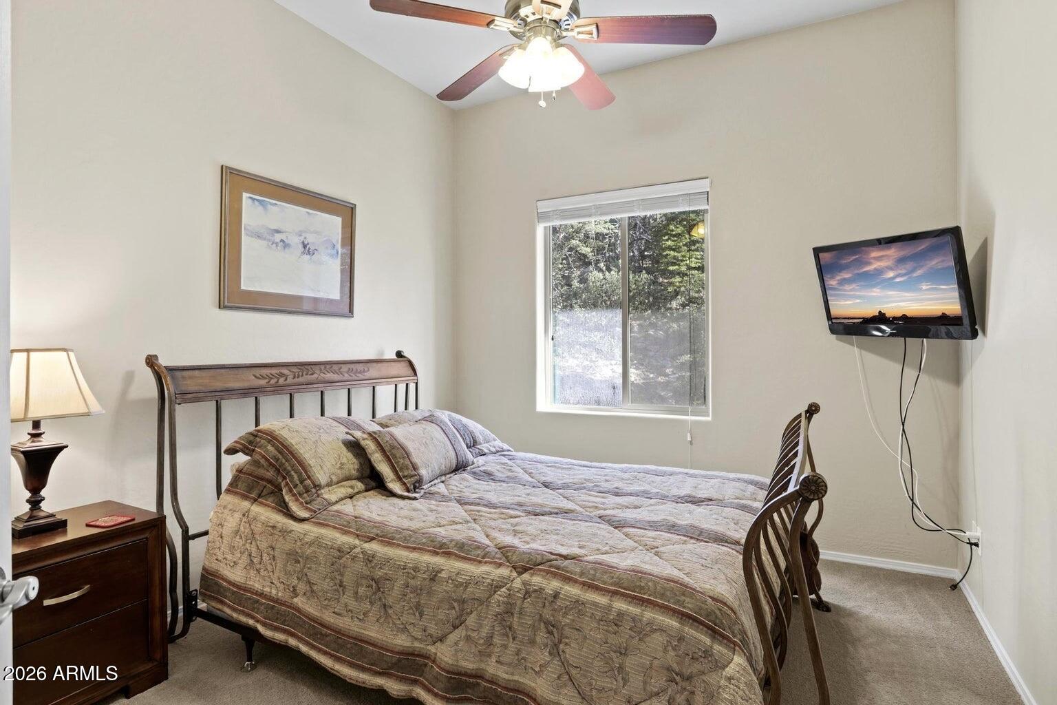 415 East Rim Estates Trail Payson, AZ 85541 - Photo 27 of 76 a bedroom with bed and a window