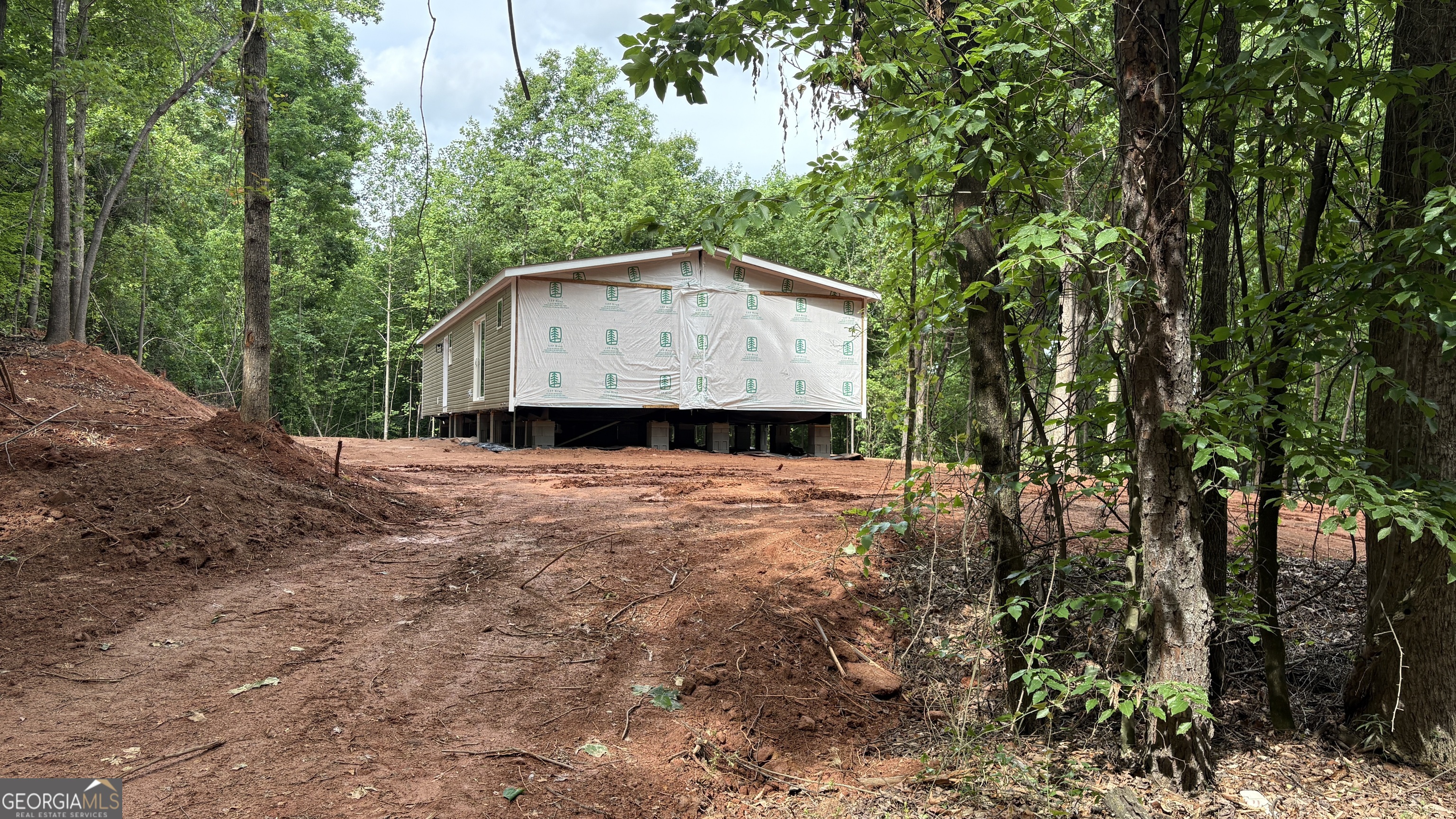 1020 Neal Road Commerce, GA 30530 - Photo 13 of 25 a house with trees in the background