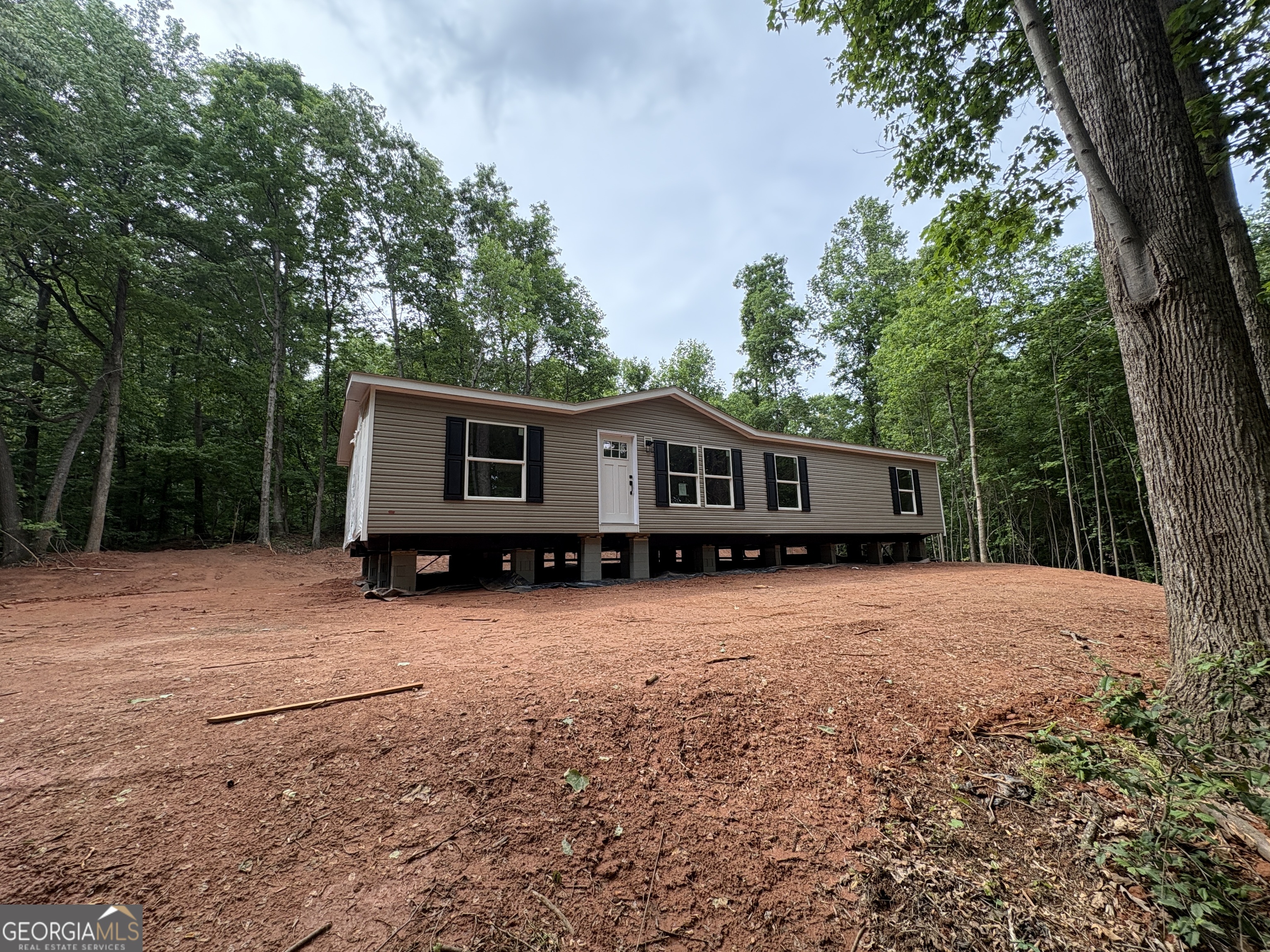 1020 Neal Road Commerce, GA 30530 - Photo 15 of 25 a front view of a house with a yard