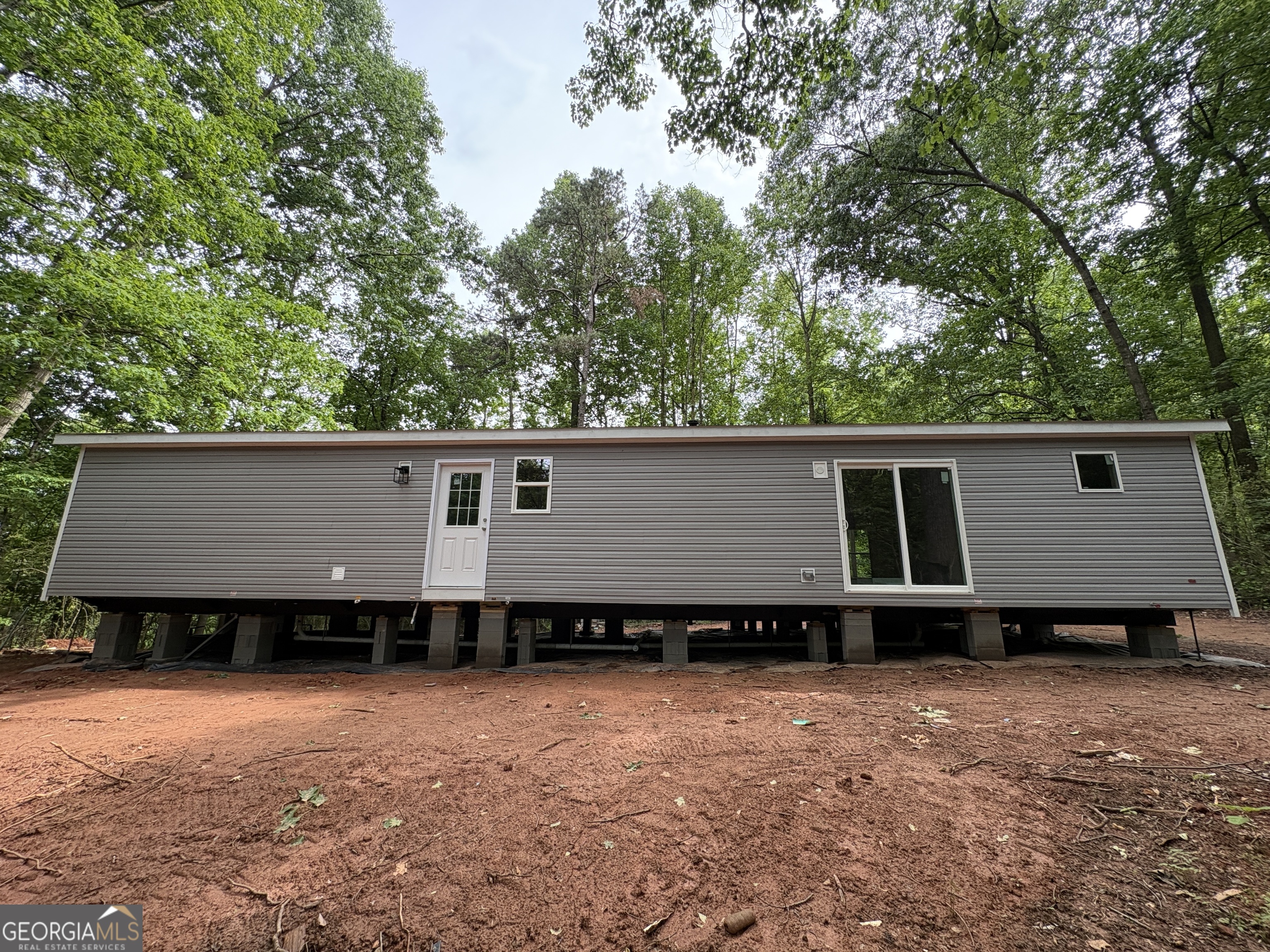 1020 Neal Road Commerce, GA 30530 - Photo 7 of 25 front view of a house with a yard