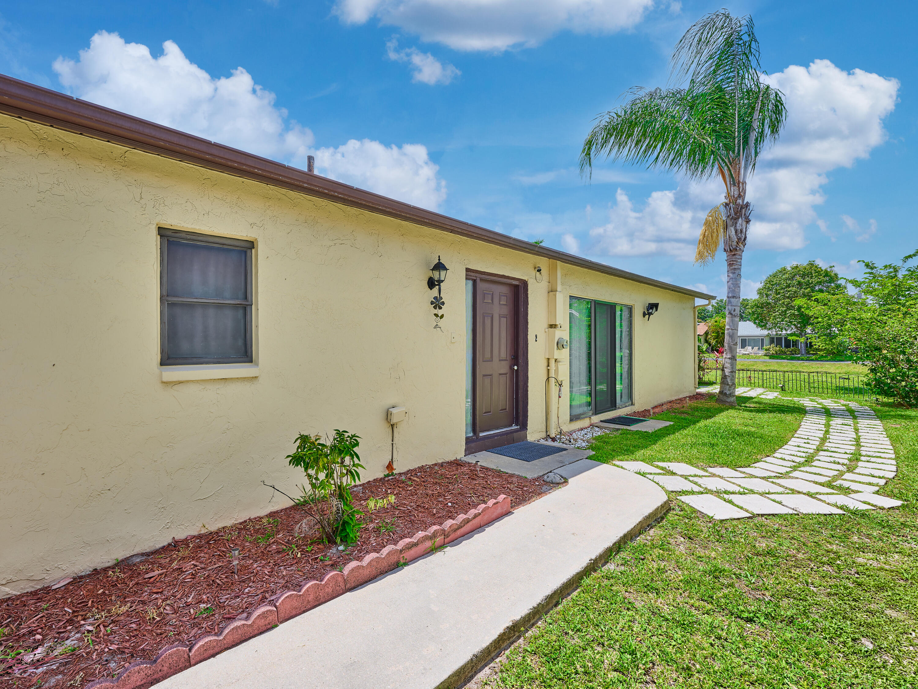 5197 Minto Road Boynton Beach, FL 33472 - Photo 2 of 32 a front view of a house with garden