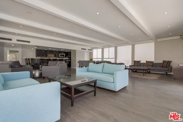 a living room with furniture and a table