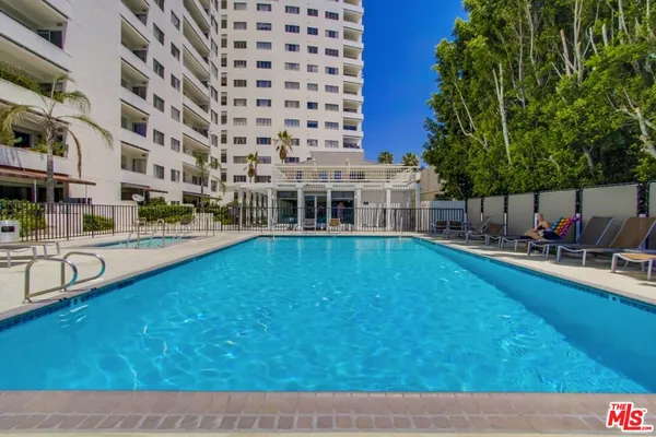 a view of swimming pool with outdoor seating