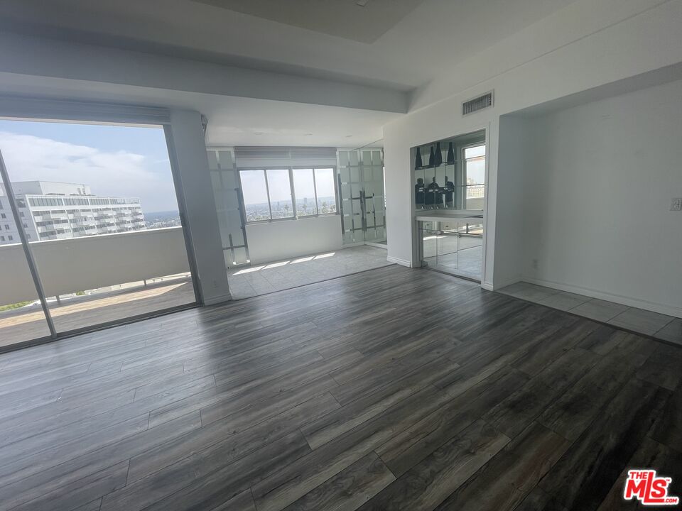 7250 Franklin Avenue, Unit 702 Los Angeles, CA 90046 - Photo 17 of 39 wooden floor in an empty room with a window