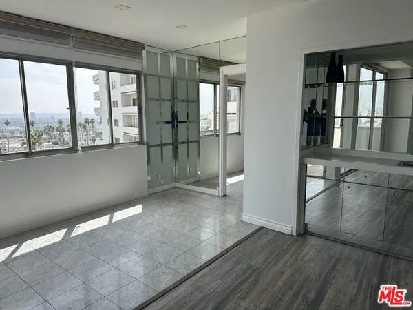 a view of a room that has a large window